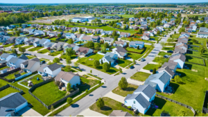 Aerial view of the residential homes during a vibrant sunny summer day